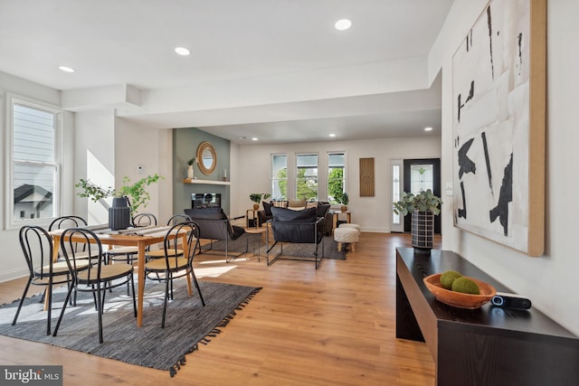 dining space featuring recessed lighting, light wood finished floors, and baseboards