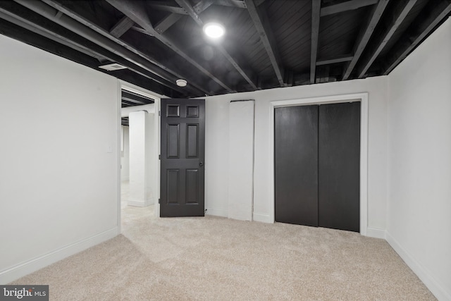 finished basement with baseboards and carpet
