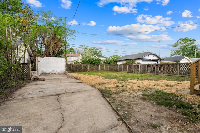 view of yard featuring a gate and fence private yard