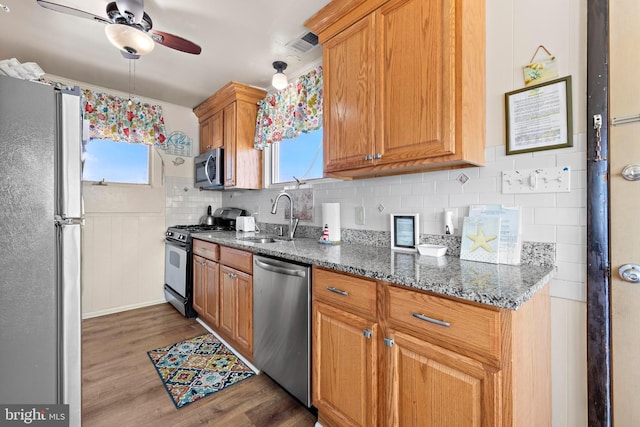 4505-4507 Ocean Blvd, Long Beach Township, NJ 08008 - kitchen with a sink, wood finished floors, ceiling fan, a wealth of natural light, and appliances with stainless steel finishes