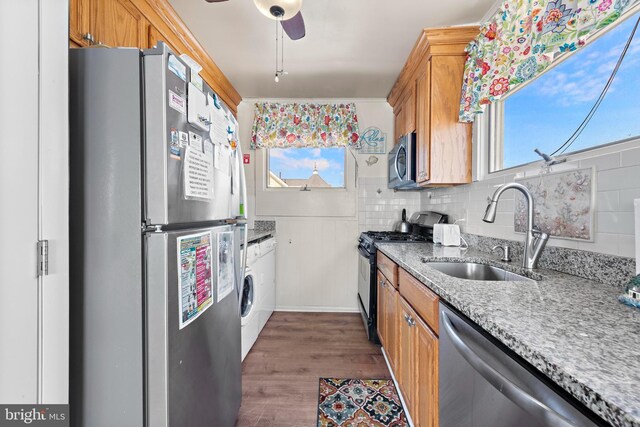 4505-4507 Ocean Blvd, Long Beach Township, NJ 08008 - kitchen with light stone counters, ceiling fan, a sink, appliances with stainless steel finishes, and dark wood-style floors