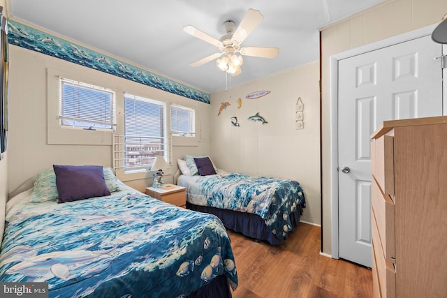 4505-4507 Ocean Blvd, Long Beach Township, NJ 08008 - bedroom featuring crown molding, wood finished floors, and a ceiling fan
