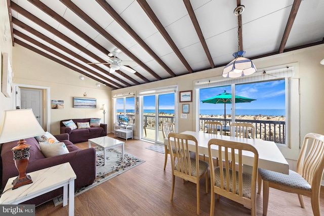 4505-4507 Ocean Blvd, Long Beach Township, NJ 08008 - dining space with a water view, lofted ceiling with beams, ceiling fan, and wood finished floors