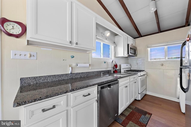 4505-4507 Ocean Blvd, Long Beach Township, NJ 08008 - kitchen featuring a sink, lofted ceiling with beams, white cabinetry, appliances with stainless steel finishes, and dark wood-style floors