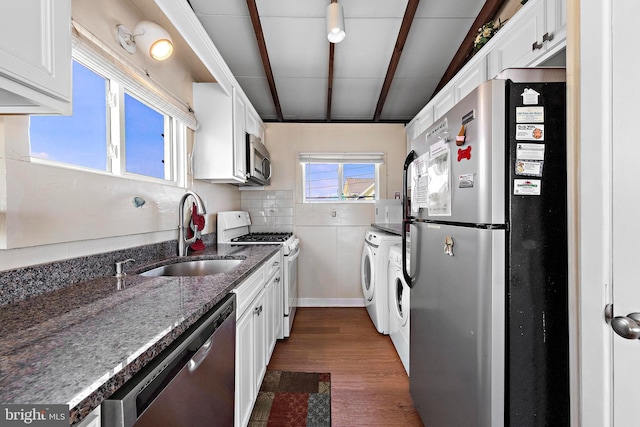 4505-4507 Ocean Blvd, Long Beach Township, NJ 08008 - kitchen featuring a sink, dark stone counters, stainless steel appliances, white cabinets, and dark wood finished floors