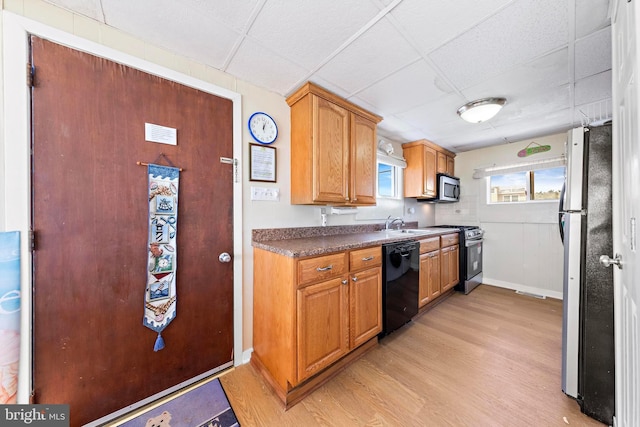 4505-4507 Ocean Blvd, Long Beach Township, NJ 08008 - kitchen featuring baseboards, a drop ceiling, light wood finished floors, and stainless steel appliances