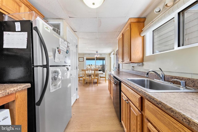 4505-4507 Ocean Blvd, Long Beach Township, NJ 08008 - kitchen with a sink, freestanding refrigerator, dishwasher, light wood finished floors, and a drop ceiling