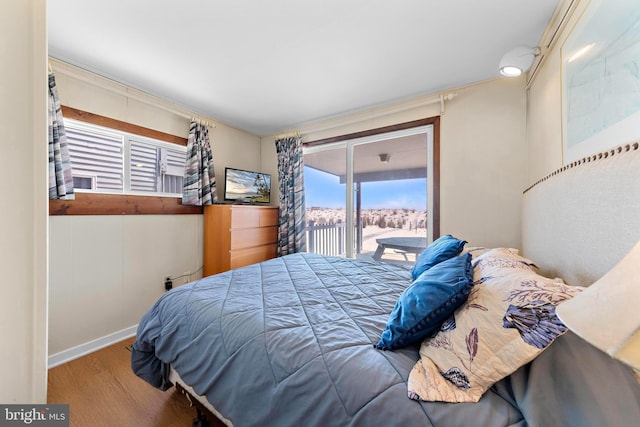 4505-4507 Ocean Blvd, Long Beach Township, NJ 08008 - bedroom with wood finished floors, baseboards, and access to exterior