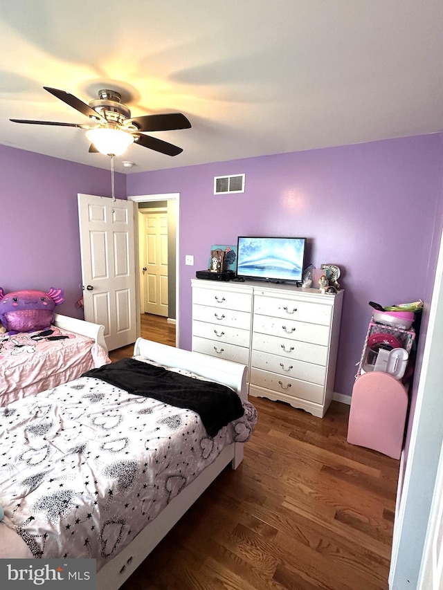bedroom featuring wood finished floors and a ceiling fan
