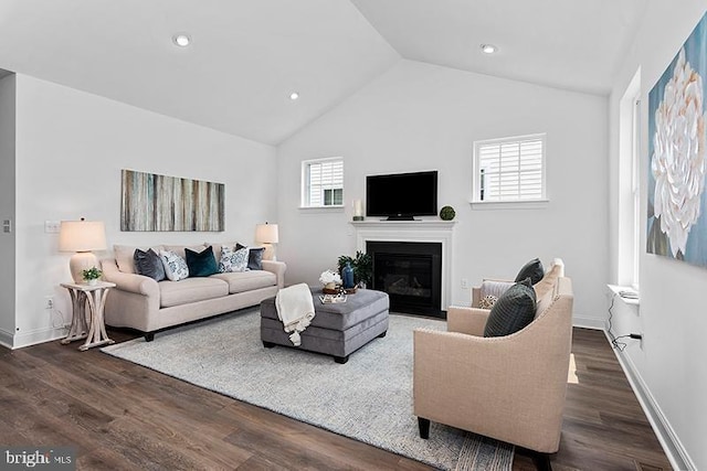 412 Dexter Dr Unit 137Ashton, Carriage, Middletown, DE 19709 - living area featuring vaulted ceiling, dark wood-type flooring, a glass covered fireplace, baseboards, and recessed lighting