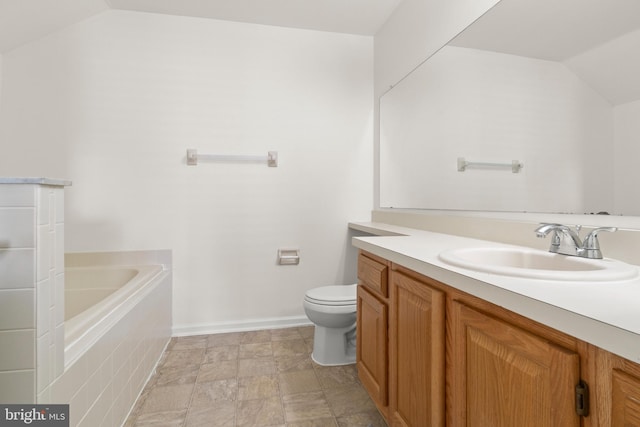 1404 Wharton Rd, Mount Laurel, NJ 08054 - full bathroom featuring vaulted ceiling, toilet, vanity, a tub to relax in, and baseboards