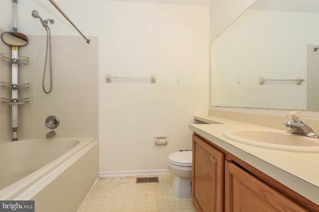 bathroom featuring vanity, toilet, baseboards, shower / bathing tub combination, and visible vents