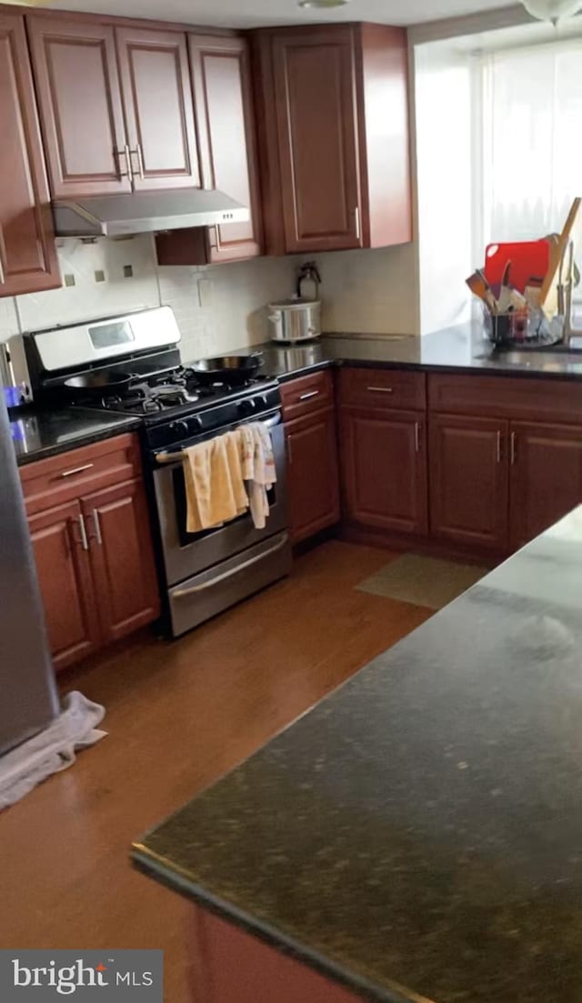 120 Garrett Ave, Bryn Mawr, PA 19010 - kitchen with dark countertops, under cabinet range hood, and gas range
