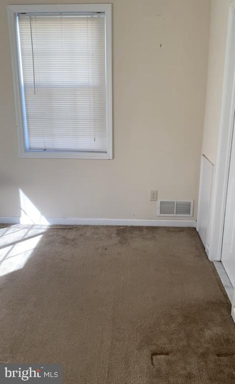 120 Garrett Ave, Bryn Mawr, PA 19010 - carpeted empty room with visible vents, baseboards, and a healthy amount of sunlight
