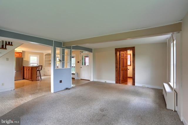 501 Walker Hill Rd, Newport, PA 17074 - unfurnished living room with light colored carpet, healthy amount of natural light, stairway, and baseboards