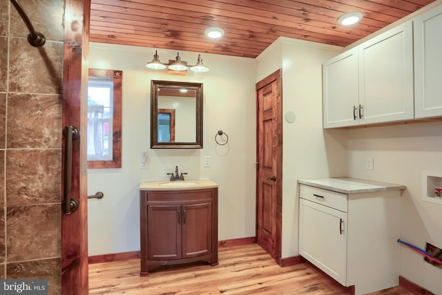 501 Walker Hill Rd, Newport, PA 17074 - bathroom with wooden ceiling, wood finished floors, baseboards, recessed lighting, and vanity