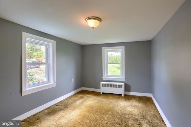 501 Walker Hill Rd, Newport, PA 17074 - carpeted spare room featuring radiator and baseboards