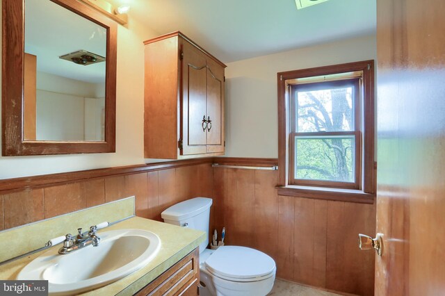 501 Walker Hill Rd, Newport, PA 17074 - half bathroom with a wainscoted wall, toilet, and vanity