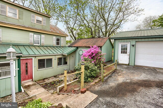 501 Walker Hill Rd, Newport, PA 17074 - view of front of house featuring metal roof, an outdoor structure, and fence