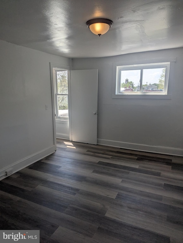 426 Royden St, Camden, NJ 08103 - empty room featuring baseboards and dark wood-style flooring