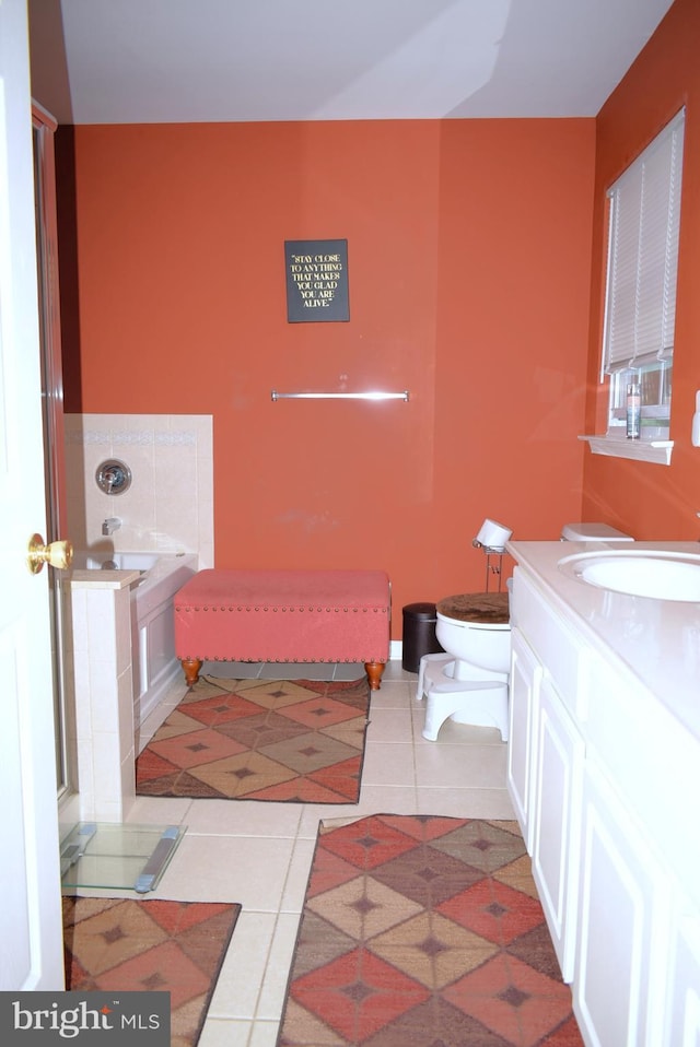 bathroom featuring tile patterned floors, toilet, and vanity