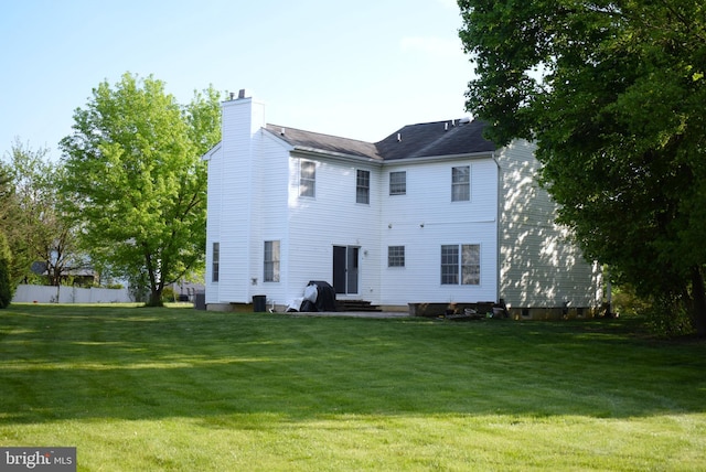 rear view of house with a chimney
