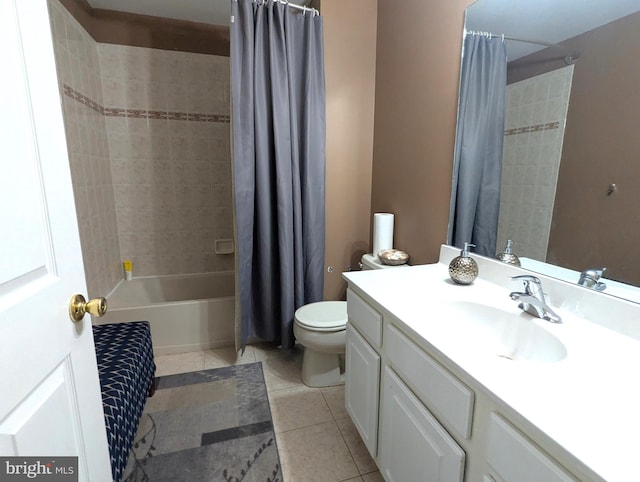 full bath featuring tile patterned flooring, toilet, vanity, and shower / bath combo with shower curtain