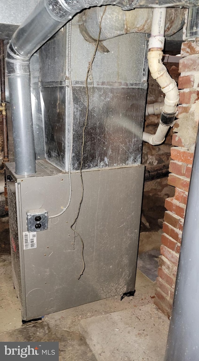 utility room with heating unit