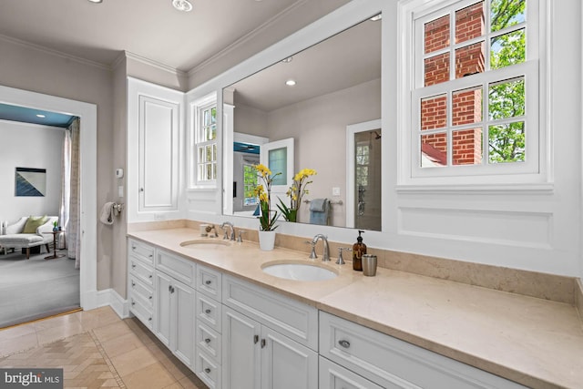 3101 Highland Pl NW, Washington, DC 20008 - bathroom with crown molding, double vanity, baseboards, and a sink