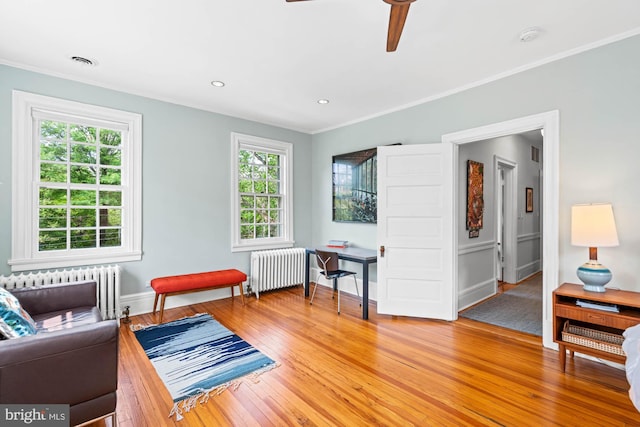 3101 Highland Pl NW, Washington, DC 20008 - living area with crown molding, radiator, ceiling fan, and light wood-type flooring