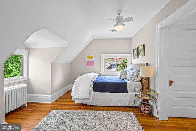 3101 Highland Pl NW, Washington, DC 20008 - bedroom featuring baseboards, lofted ceiling, wood finished floors, and radiator