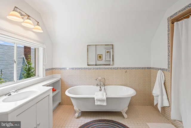 3101 Highland Pl NW, Washington, DC 20008 - full bath with tile patterned flooring, a freestanding bath, wainscoting, and lofted ceiling