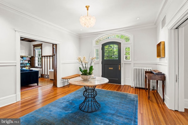 3101 Highland Pl NW, Washington, DC 20008 - foyer with an inviting chandelier, radiator heating unit, visible vents, and wood finished floors