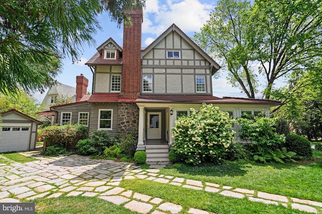 3101 Highland Pl NW, Washington, DC 20008 - english style home with a detached garage, an outbuilding, a front yard, and stucco siding