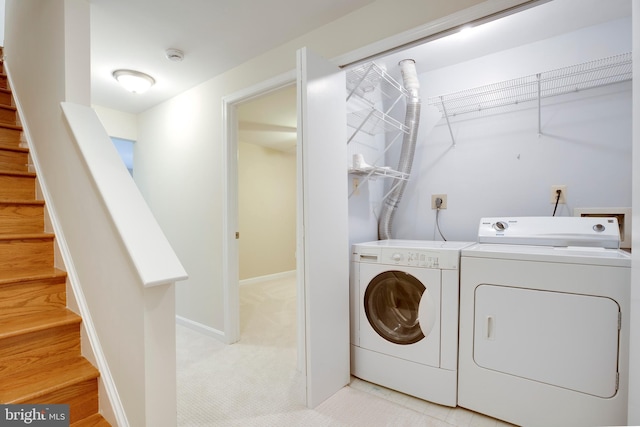 laundry room with washing machine and dryer
