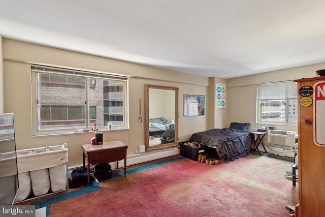 bedroom with a baseboard radiator and carpet floors