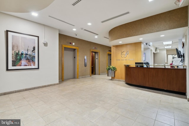 reception featuring recessed lighting