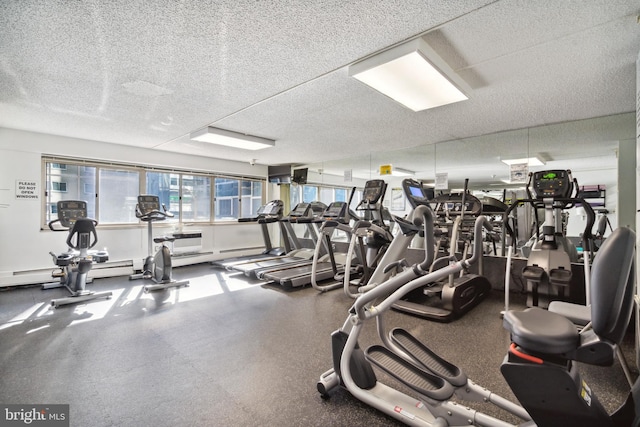 workout area with a textured ceiling