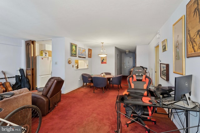 office space featuring carpet floors and baseboards