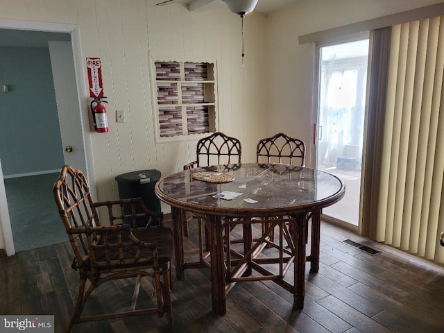 dining room with wood-type flooring and visible vents
