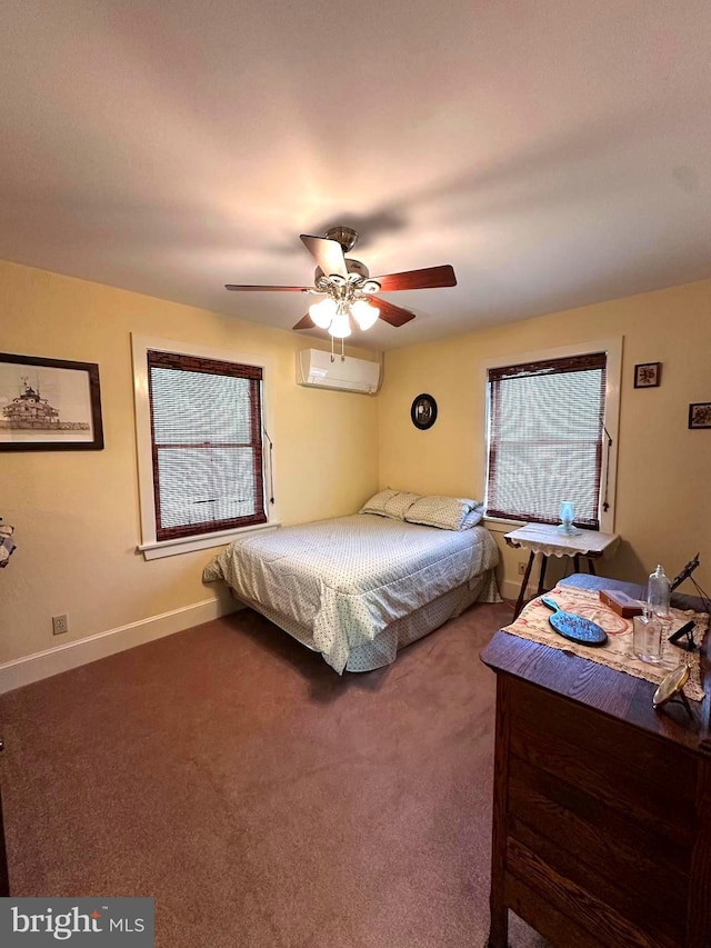 carpeted bedroom featuring a ceiling fan, baseboards, and a wall unit AC
