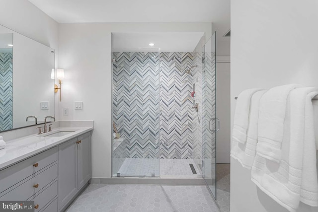 full bathroom with vanity, recessed lighting, tile patterned floors, and a shower stall