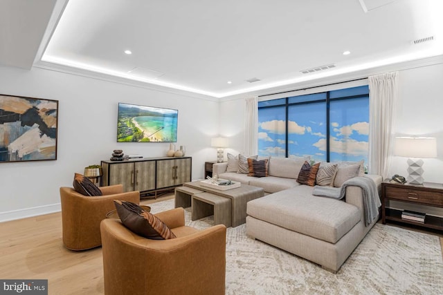 living room featuring recessed lighting, visible vents, and light wood-style flooring