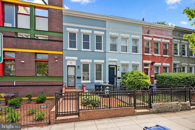66 O St NW, Washington, DC 20001 - multi unit property with brick siding, a fenced front yard, and a chimney