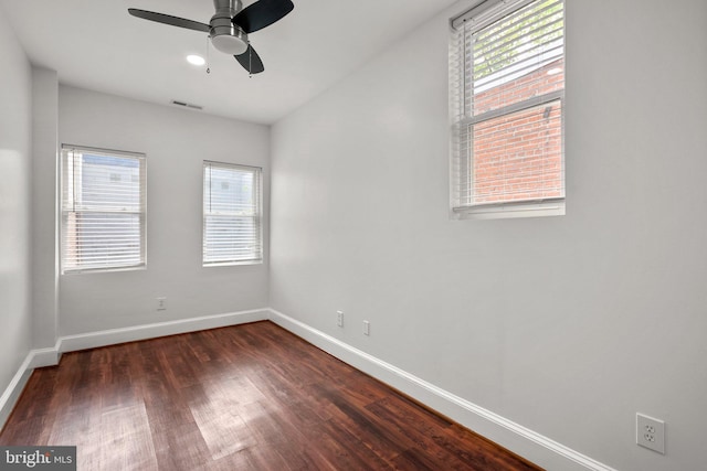66 O St NW, Washington, DC 20001 - spare room with a ceiling fan, baseboards, visible vents, and dark wood-style floors