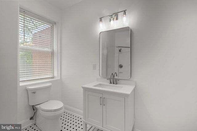 66 O St NW, Washington, DC 20001 - bathroom with baseboards, walk in shower, toilet, and vanity