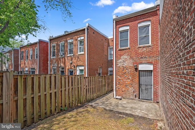 66 O St NW, Washington, DC 20001 - rear view of property featuring fence and brick siding