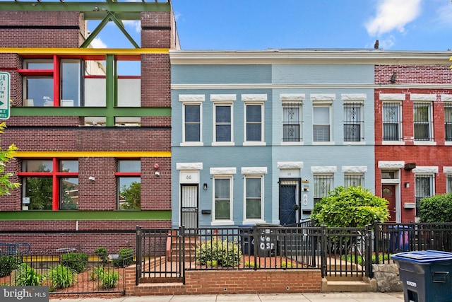 66 O St NW, Washington, DC 20001 - view of front of home featuring brick siding and fence