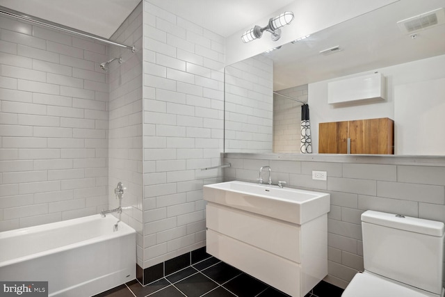 2030 8th St NW Unit Ph-5, Washington, DC 20001 - bathroom with tile walls, tile patterned flooring, toilet, vanity, and tub / shower combination