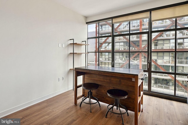 2030 8th St NW Unit Ph-5, Washington, DC 20001 - dining area with baseboards, wood finished floors, and a dry bar